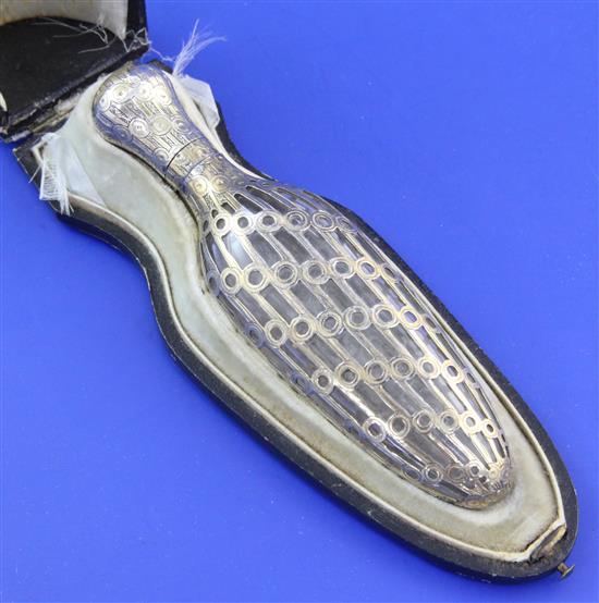 A cased late 19th/early 20th century French silver gilt overlaid glass teardrop shaped scent bottle, 4.5in.